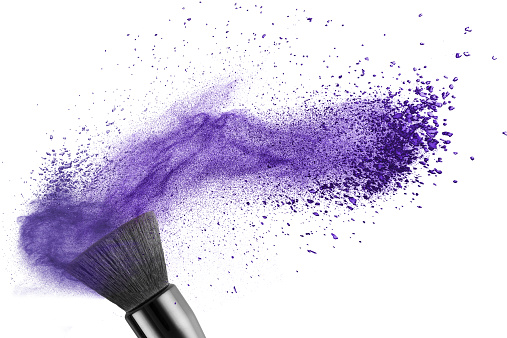 makup brush with blue powder isolated on white