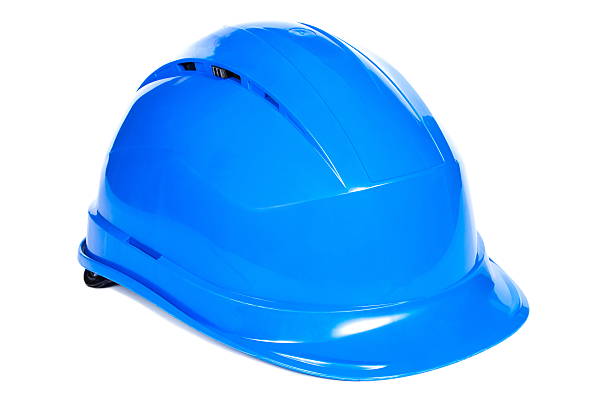 Closeup of blue protective helmet on white background, concept of security and protection at work