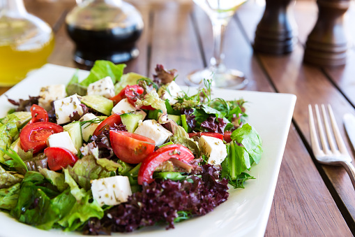 Greek Mediterranean salad with feta cheese, tomatoes and peppers. Mediterranean salad. Mediterranean cuisine. Greek cuisine.