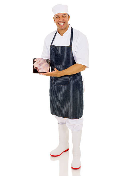 istock mature butcher showing fresh meat 515747134