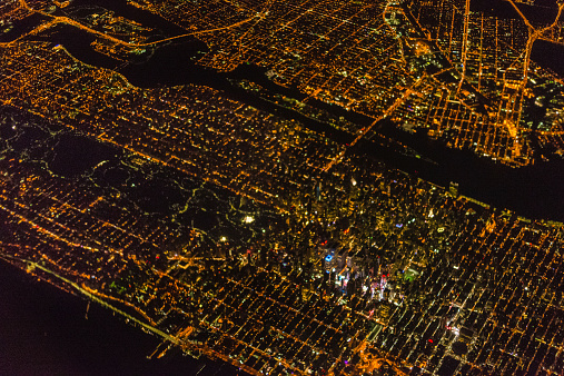 Bird's-eye view of Midtown Manhattan at night. Midtown and all relevant landmarks are clearly visible, as well as Central Park and the Hudson River.
