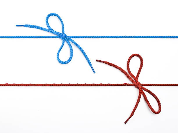 istock Blue and red shoelace with bow 515748348