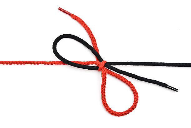 istock Red and black shoelace with bow 515748480