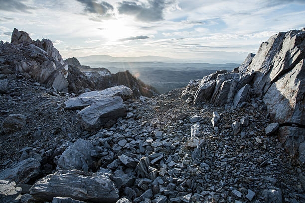 rocky mountain and sunset rocky mountain and sunset in the  background extreme terrain stock pictures, royalty-free photos & images