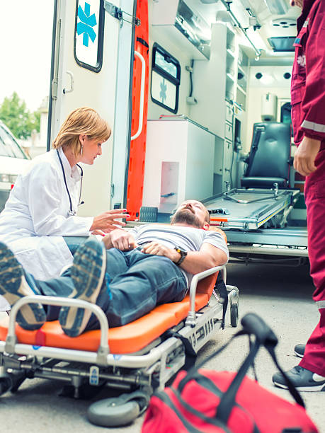 istock Medical emergency team helping injured man 515750798