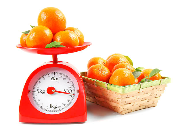istock Tangerines on scales and in a basket 515769259