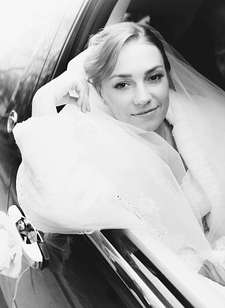 istock Beautiful bride looking out of car 515769741