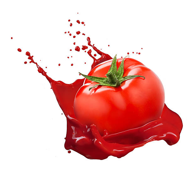 istock Red tomato with juice splash isolated on white 515776175