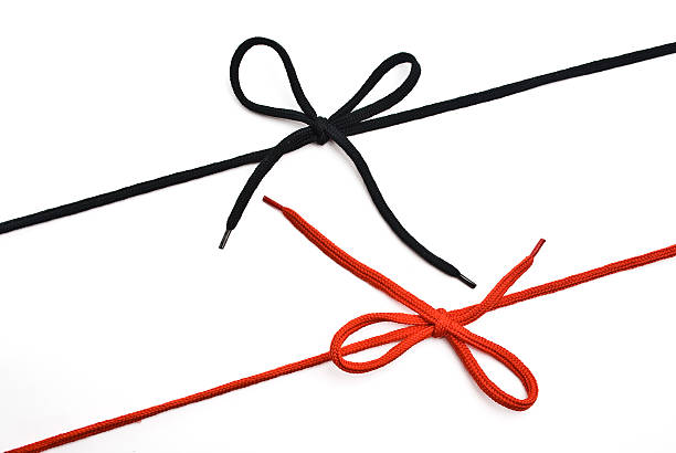 istock Red and black shoelace with bow 515777310