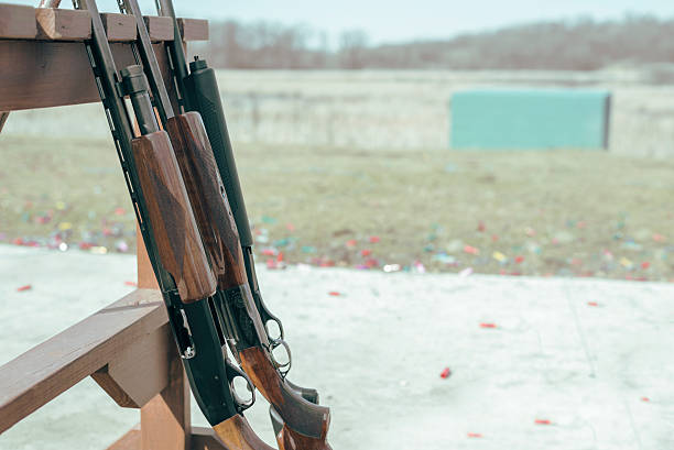 istock row of shotgun rifles on rack at shooting range 515777364