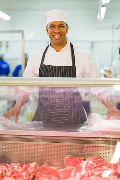 istock mature butcher standing in butchery 515778872