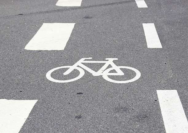istock Horizontal bicycle sign on asphalt with white stripes 515779433