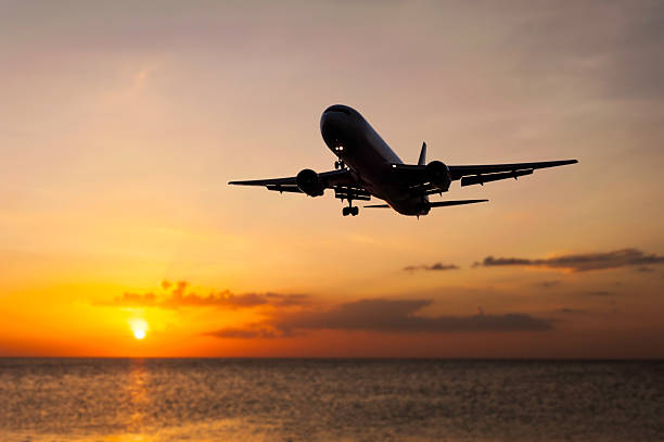 istock Plane on blurred color of the sunset 515779946