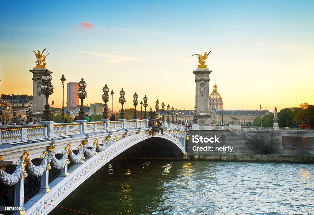 Bridge of Alexandre III at sunset Alexandre III Bridge at sunset in  Paris, France, retro toned Ancient Stock Photo