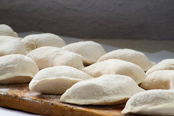 Delicious dumplings are modeled ready for cooking in hot waterDelicious dumplings are modeled ready for cooking in hot water