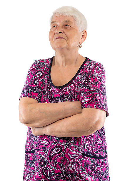 istock Elderly woman with arms crossed looking up 515780106
