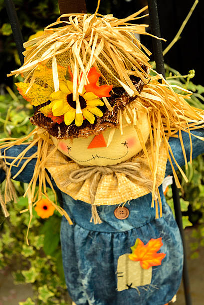 istock scarecrows with flowers and hay 515780497
