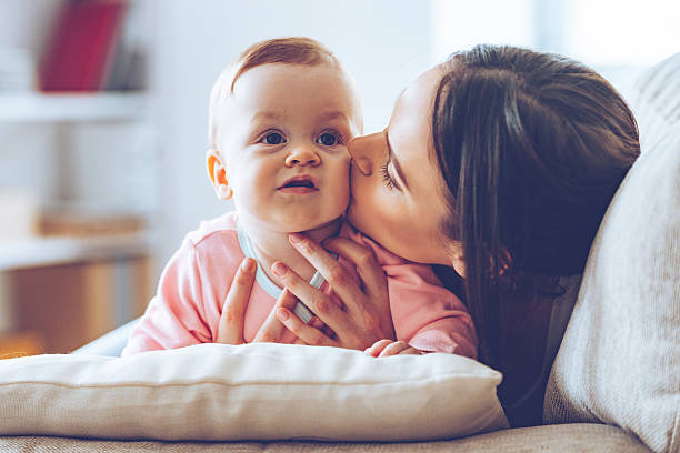 istock Sweet kiss from mommy. 515781560