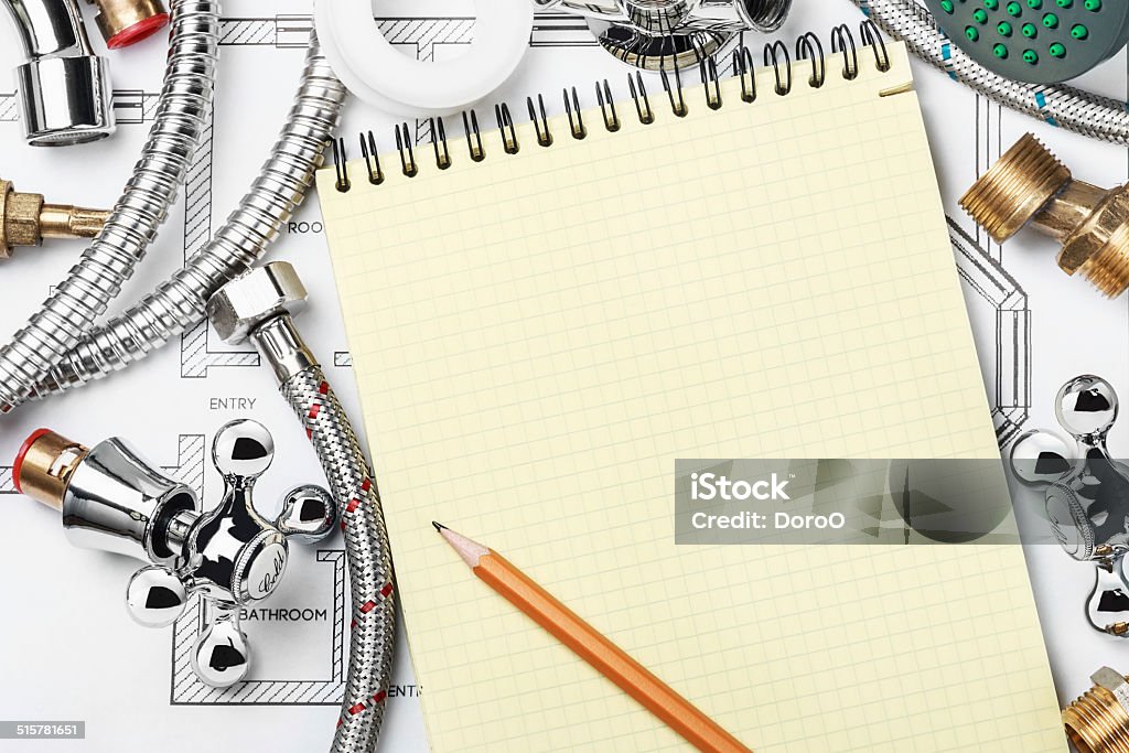 plumbing and tools with a notebook plumbing and tools with a notebook to write text Backgrounds Stock Photo