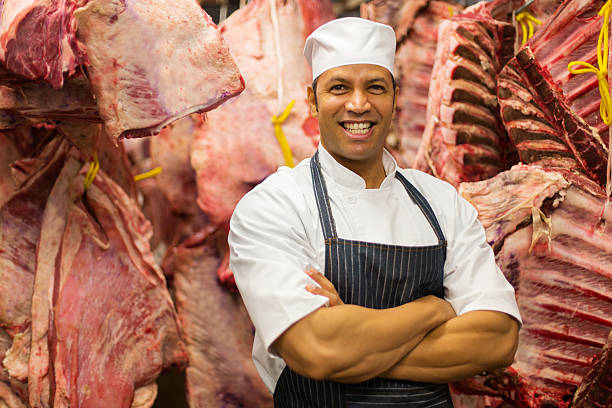 istock mature male butcher standing in storage room 515782014