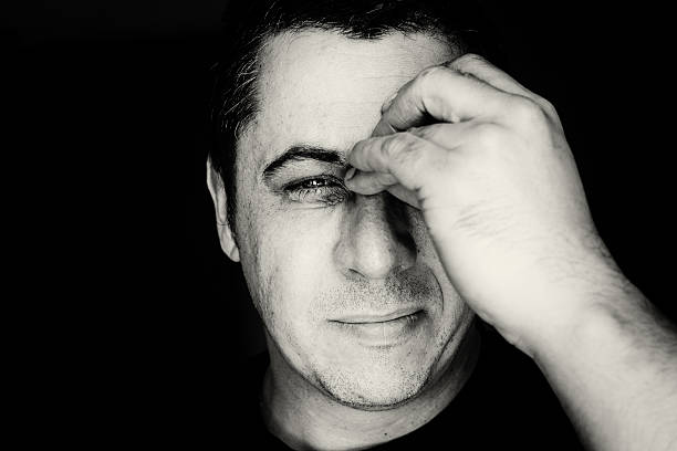 istock Man in Black and White with Head Ache Pain 515784462