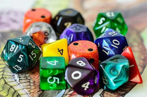 role playing dices lying on picture background - stock photo