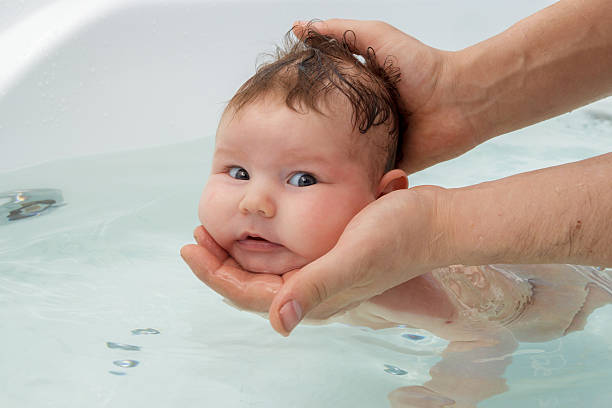 istock Newborn baby bathe and swim 515784852