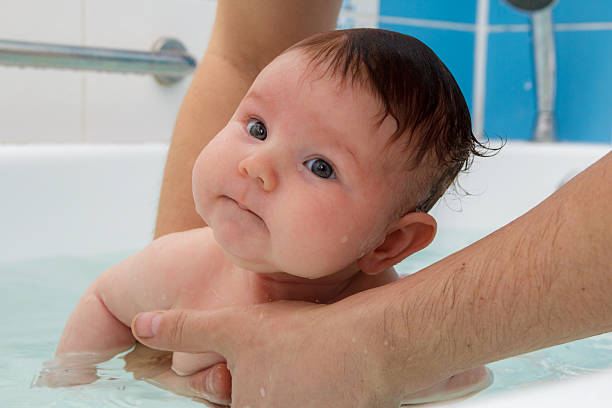 istock Newborn baby bathe and swim 515785330