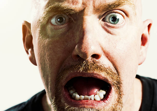 istock Shocked and terrified mature man gasps 515786288