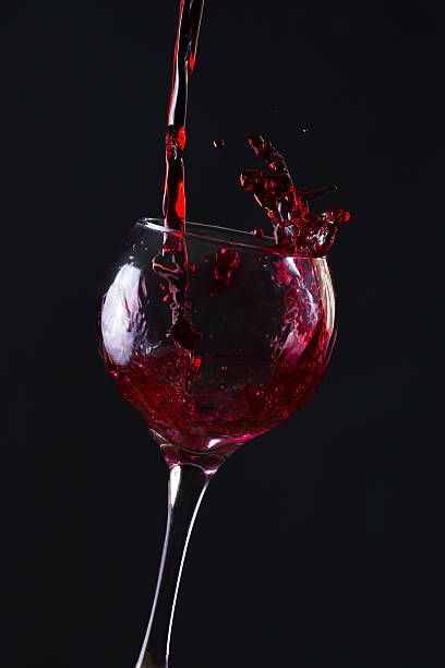 istock Red Wine Pouring into glass 515786586