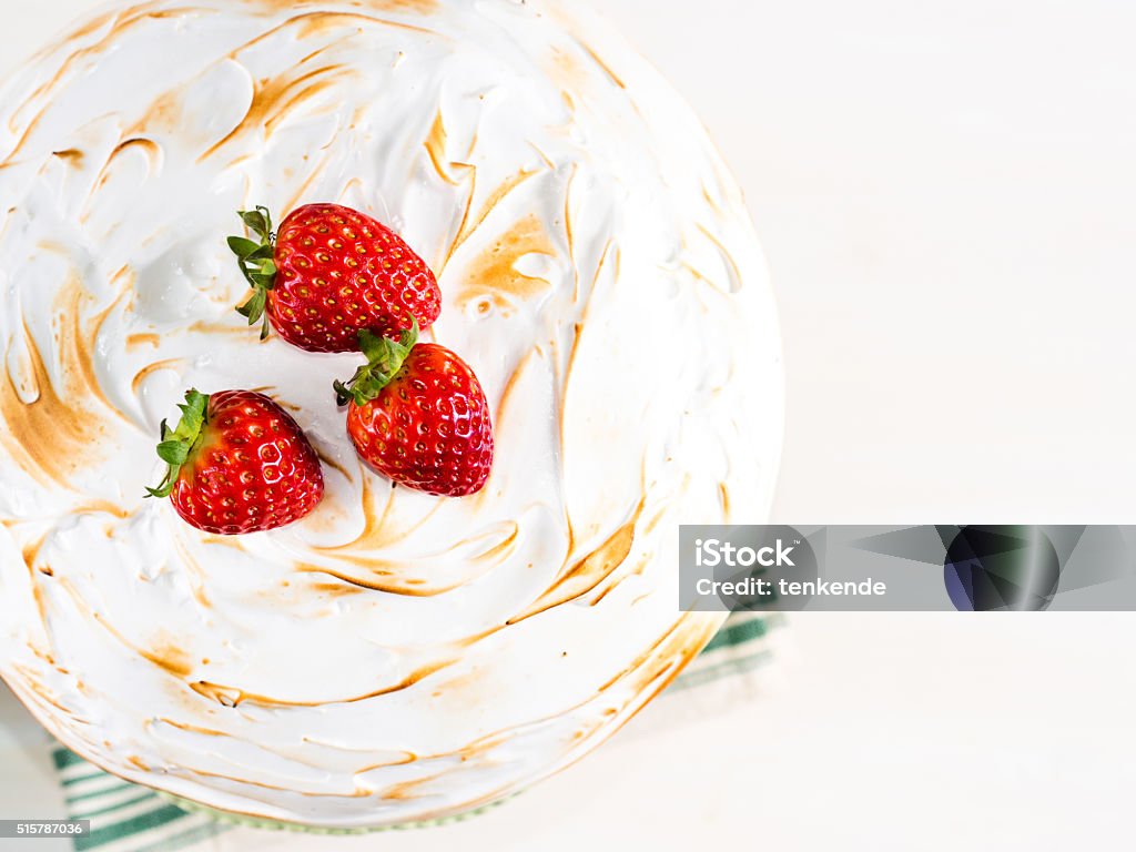 Cake with meringue Sponge cake with Swiss meringue on white and gray pastel wooden background Backgrounds Stock Photo