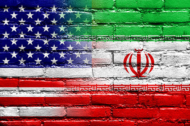 istock Iran and USA Flag painted on brick wall 515787061