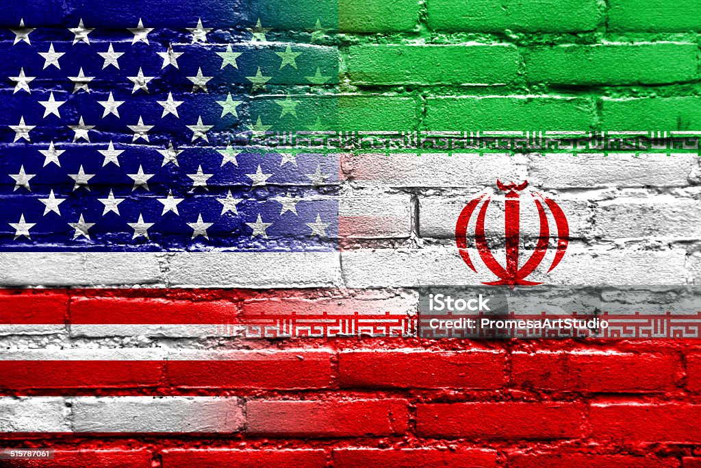 Iran and USA Flag painted on brick wall Iran Stock Photo