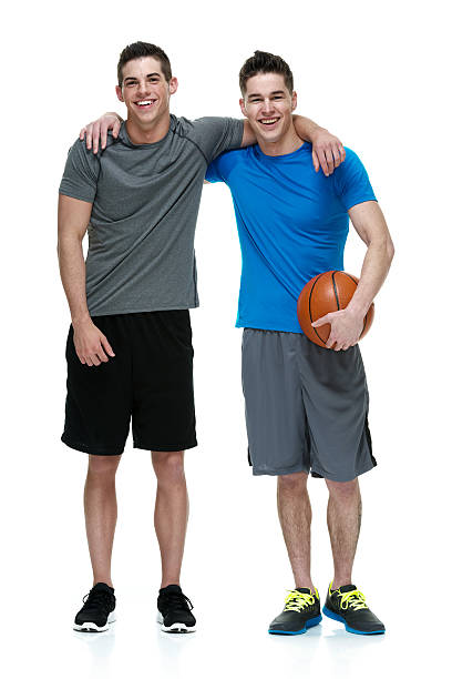 istock Two people holding basketball 515787085
