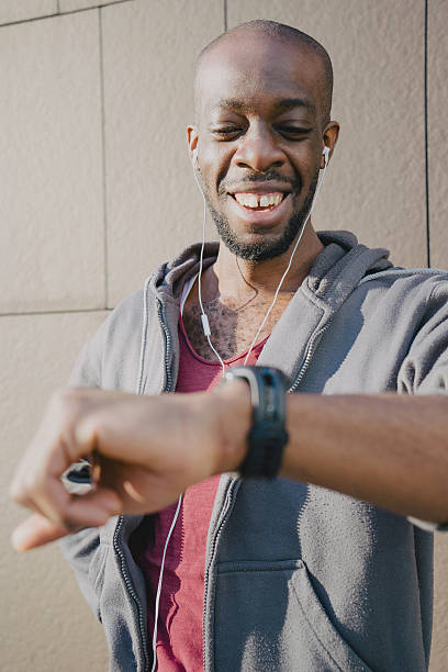istock Cheerful Sport Man Looking At His Smart Watch 515787160