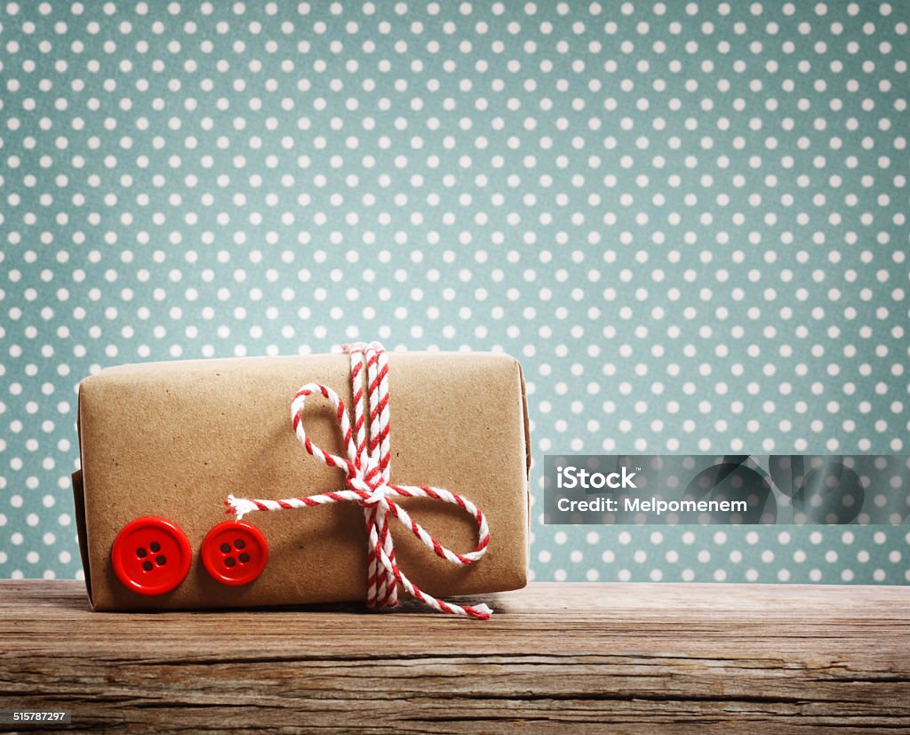 Hand made gift box Hand made gift box over blue polka dots background Art And Craft Stock Photo