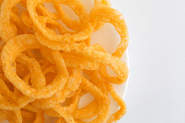 istock Crunchy onion rings on plate atop tablecloth 515787928