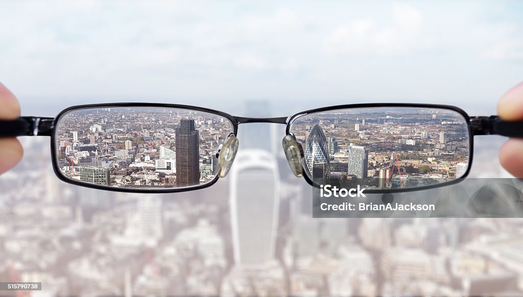 Clear business vision Clear business vision concept businessman looking at the financial district of the city of London Personal Perspective Stock Photo