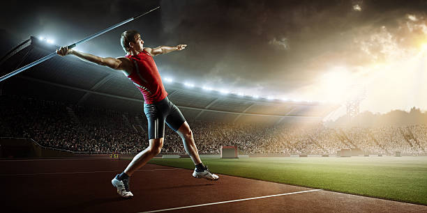 Javelin thrower :biggrin:Javelin athlete is going to perform a javelin throw on an . stadium full of spectators. javelin stock pictures, royalty-free photos & images