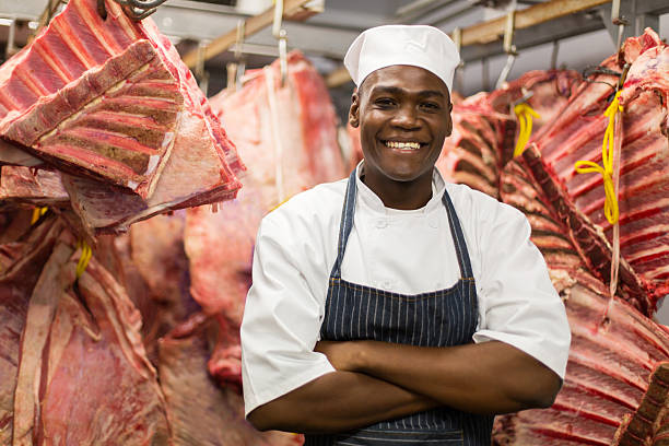 istock african butcher standing in meat storeroom 515791552
