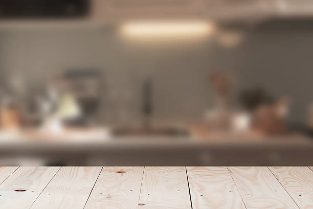 istock Wood Table Top And Blur the kitchen. 515791748