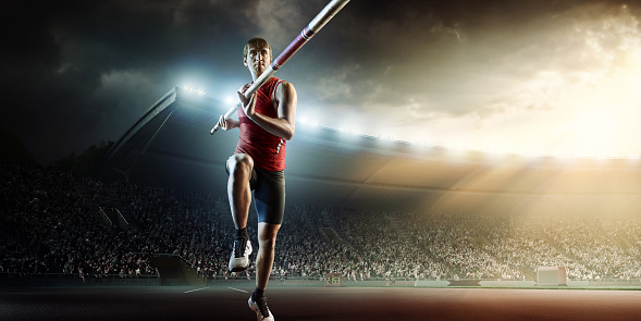 :biggrin:Pole vaulting athlete is going to perform a high jump on an . stadium full of spectators.