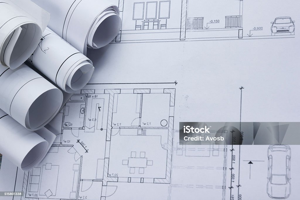 Architect worplace top view. Architectural project, blueprints, blueprint rolls on Architect worplace top view. Architectural project, blueprints, blueprint rolls on plans. Construction background. Engineering tools. Copy space. Plan - Document Stock Photo