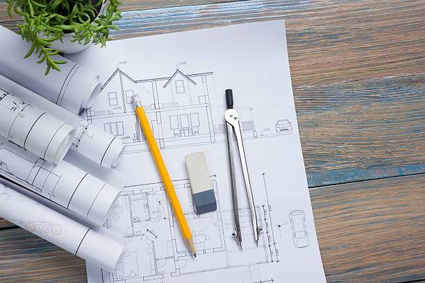 istock Architect worplace top view. Architectural project, blueprints, blueprint rolls and 515801482