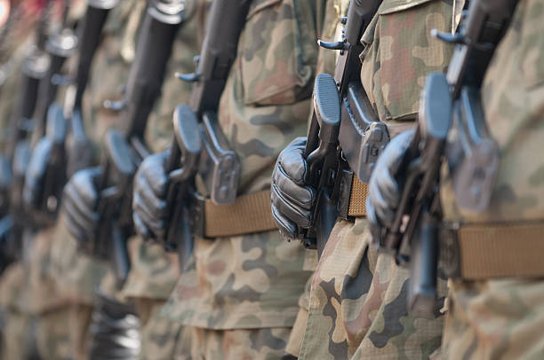 istock Army parade - armed soldiers in camouflage military uniform 515802926