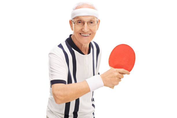istock Cheerful senior man playing ping-pong 515803290