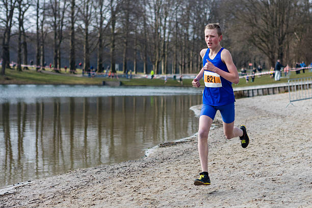 Teen Boy Cross Country Running Race stock photo