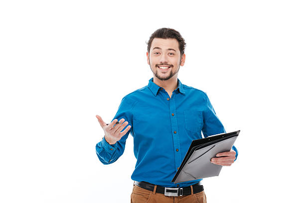 istock Happy man holding pen and clipboard 515803408