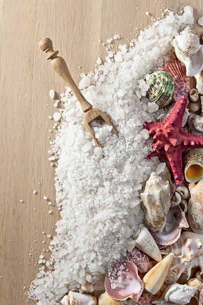 istock Sea salt on wooden table 515804772