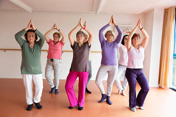 istock active senior women yoga class 515805616